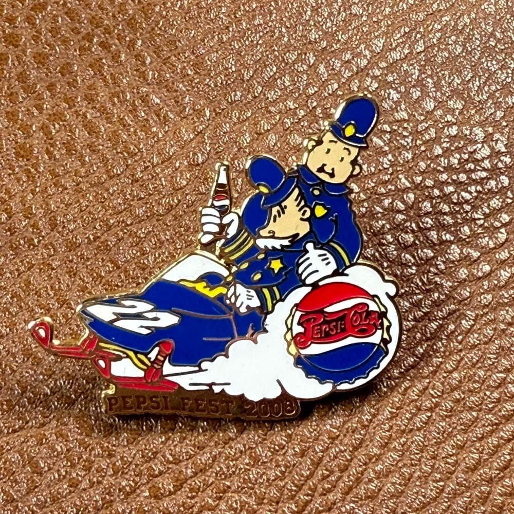 Pepsi Fest 2008 Enamel Pin with‎ Policeman Character Riding Sled